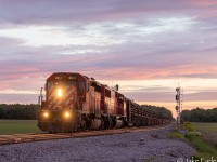 As I got word that there was a CWR headed eastward from Smiths Falls to Montreal on the Winchester, I was kind of hoping it would come sooner in Green Valley ON, but I had to drive a little further west since I was losing light. Luckily I got this train at just the right lighting, and the right angle at Avonmore.

This CP CWR train passes through the country side of Avonmore ON, with a pair of SD’s hauling loads of Continuous Welded Rail bound for the former CMQ I do believe. Weeks later, this train would drop off Rail on the Belleville Sub, with the SD60M taking the lead.