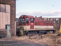 Former TH&B SW9 55 sits looking forlorn outside the Chatham Street roundhouse circa 1988. Built at GMDD London in December 1950, the unit was sold to Atlas steel of Welland in May 1988, to International Iron & Metal, also of Welland, the same year, and further to Merrilees Equipment of Lavalee, Quebec in December 1988. It would continue on to CP Forest Products in La Tuque, Quebec in September 1990, serving there until a sale to the Stone Container Corporation of Bathurst, New Brunswick as their number 01 circa November 1996. In April 2006 it would be sold to Glencore Canada Corp (formerly Xstrata/Falconbridge Mining) of Belledune, New Brunswick where it still resides per the 2021 Canadian Trackside Guide <a href=http://www.trainweb.org/oldtimetrains/industrial/nb/falconbridge_506.jpg>as their 506.</a> Information per the TH&B historical Society.