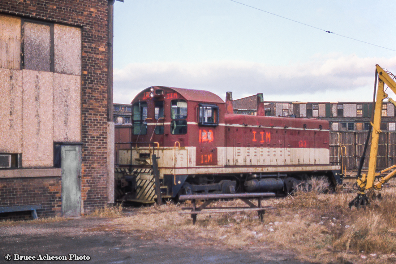 Former TH&B SW9 55 sits looking forlorn outside the Chatham Street roundhouse circa 1988. Built at GMDD London in December 1950, the unit was sold to Atlas steel of Welland in May 1988, to International Iron & Metal, also of Welland, the same year, and further to Merrilees Equipment of Lavalee, Quebec in December 1988. It would continue on to CP Forest Products in La Tuque, Quebec in September 1990, serving there until a sale to the Stone Container Corporation of Bathurst, New Brunswick as their number 01 circa November 1996. In April 2006 it would be sold to Glencore Canada Corp (formerly Xstrata/Falconbridge Mining) of Belledune, New Brunswick where it still resides per the 2021 Canadian Trackside Guide as their 506. Information per the TH&B historical Society.