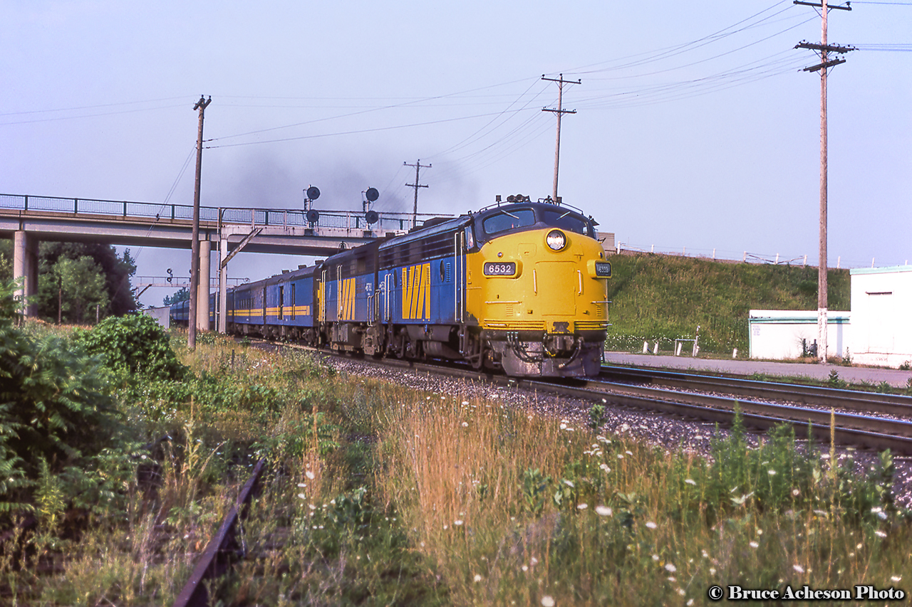 Ducking beneath Waterdown Road, VIA 73 heads west behind cab units from both GMD and MLW.  The FP9A 6532, built as CN 6532 in May 1957, would be rebuilt/numbered to FP9Au VIA 6310 in 1984.  This unit was one of the few repainted to the grey and yellow experimental scheme in 1980.  It would be wrecked on April 9, 1993 at Rapide-Blanc, Quebec after hitting a washout.  Trailing unit FPA-4 6782, built for CN in March 1959 and retired from VIA during the late 80s.