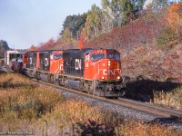 A trio of SD75is lead west into the late afternoon fall sun by mile 30.