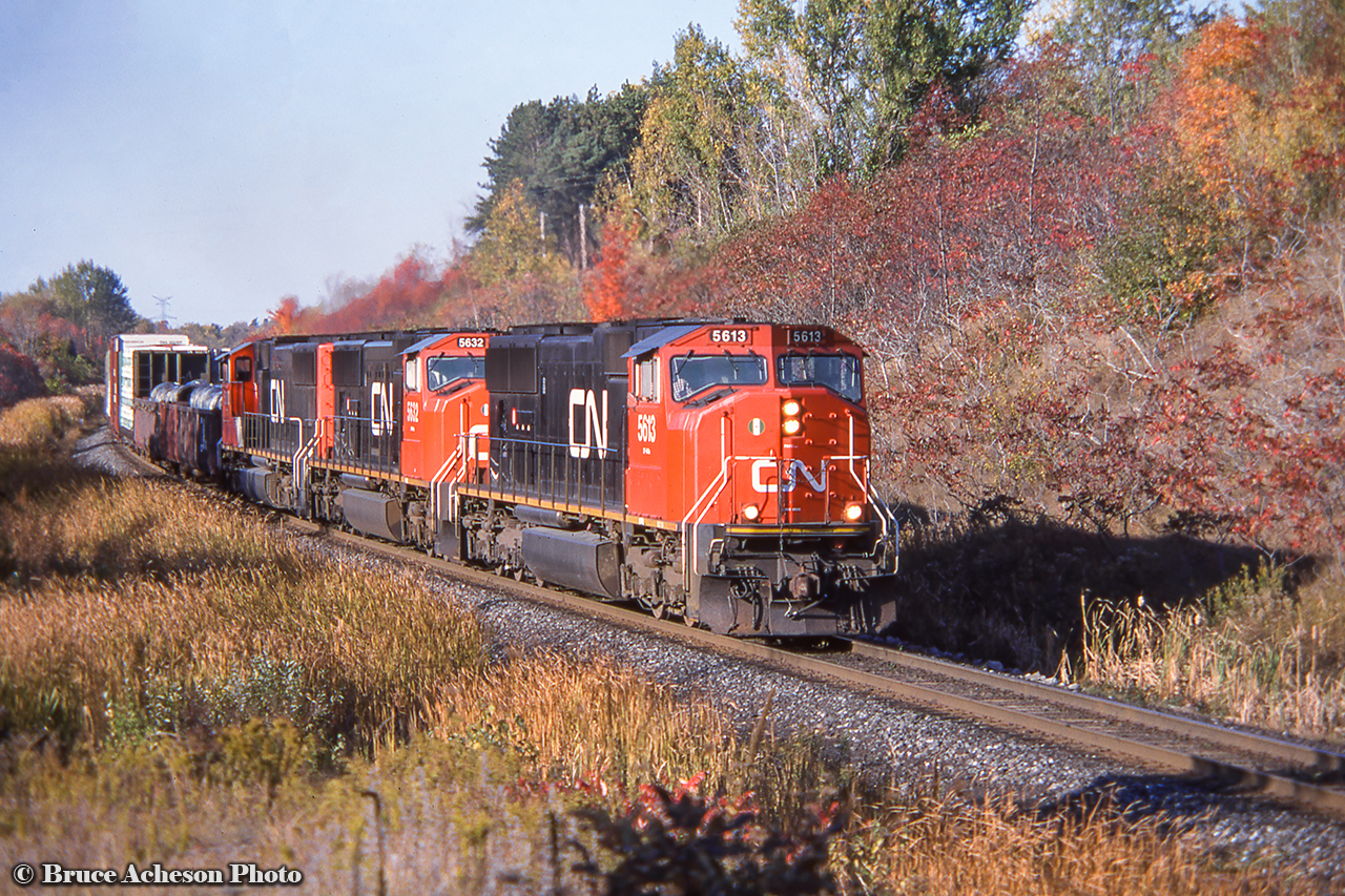 A trio of SD75is lead west into the late afternoon fall sun by mile 30.