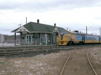 If there is a dull weather day in January, I will find it.  Here's the northbound "Northlander" passing the old Aurora station behind ONR 1986 on such a bleak day.  This locomotive was retired in 1996 after a long life as ONR 1501, before and after renumbered to 1986 for the passenger service.  The Northlander has not run since 2012, but the Ontario government, seemingly with an anchor around their heels, claim they are going to bring it back. Some day.  We'll wait.
I've not been to Aurora in quite a few years but I can imagine it has really changed since this "country" setting.