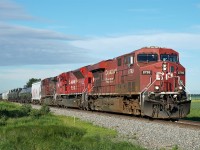 Oil train empties head east with lots of power on CP's Scotford Sub.  ES44AC CP 8799, SD70ACU CP 7037 and AC4400CW CP 9833.