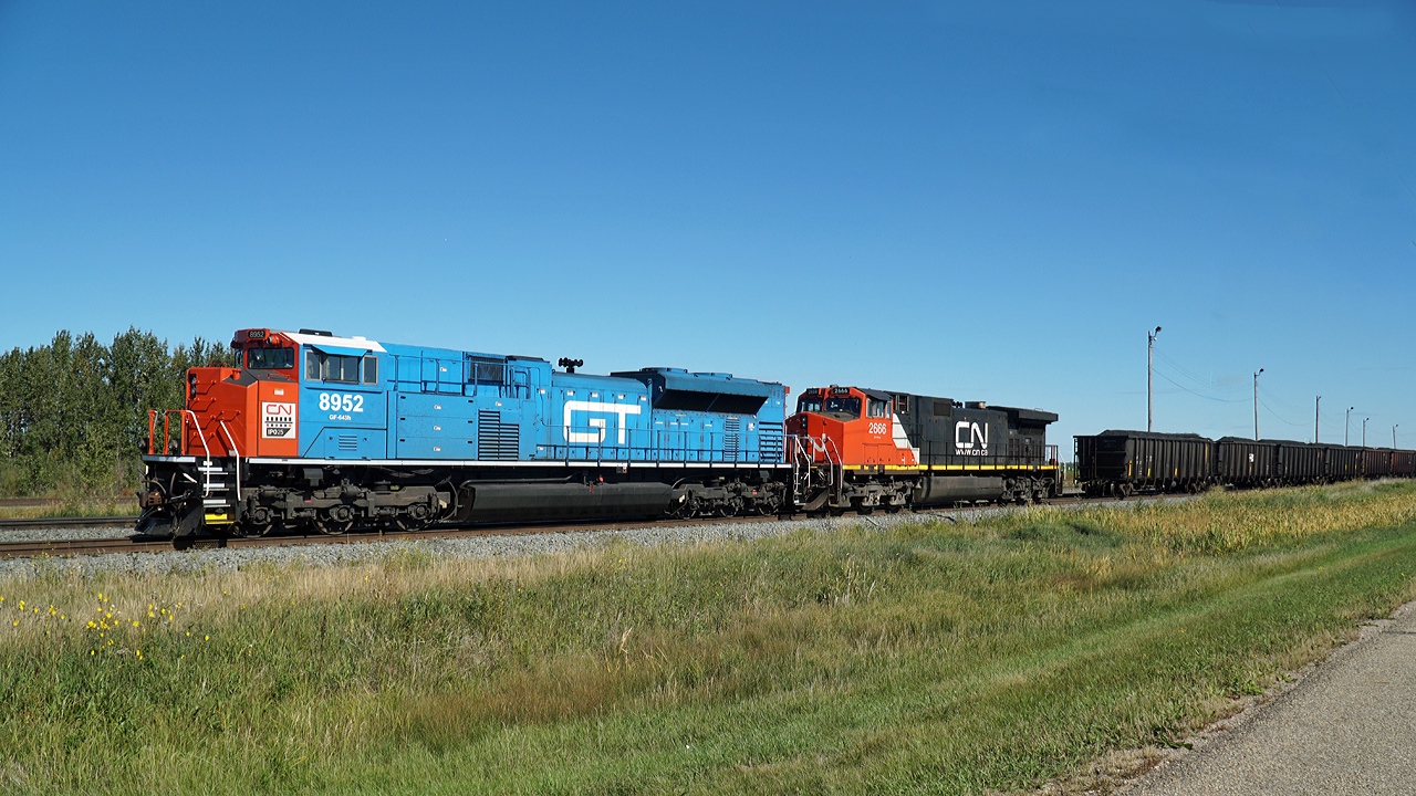 SD70M-2 CN 8952 in heritage GT livery and DASH 9-44CW CN 2666 have just set of a line of coal card in CN's Scotford Yard.