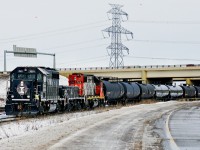 On a dull wintery day GP40-3 CN 7601 and HBU-4m #601 both in IC heritage livery assisted by GP38-2 CN 7518 are switching in Clover Bar Yard.