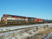 Dash 8-40CMu BCOL 4611 and Dash 8-40CW CN 2562 head west through Clover Bar with an oil train.