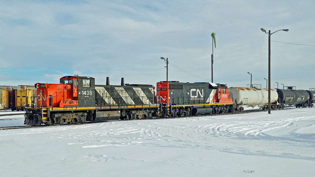 GMD-1u CN 1438 and GP38-2 CN 7514 are on switching duties in CN's Clover Bar Yard.
