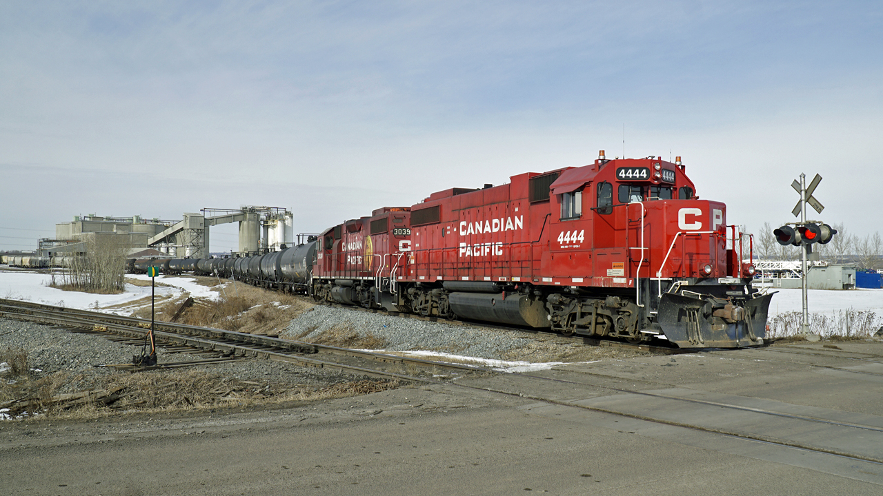 GP 38-2 CP 4444 (ex SOO) and CP 3039 are switching cars into the Lafarge Plant at Clover Bar in north east Edmonton.