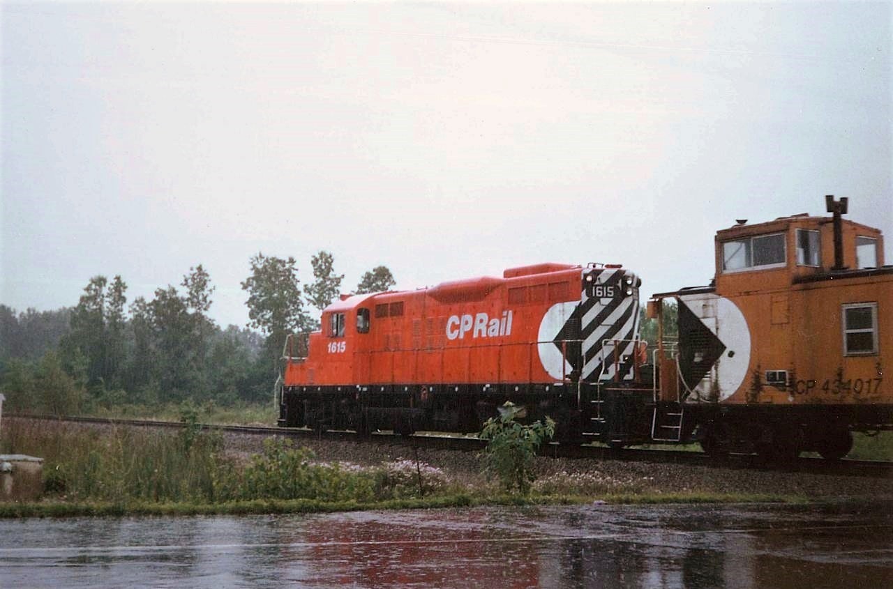 1615 and van 434017 is heading east towards Brookfield on the former CASO, having just crossed Netherby-Townline Road.  The pair were on switching assignment at the former WELLAND TUBES (STELCO) facility that is sandwiched between Ridge Road and the Welland Canal (Welland Bypass). They were likely returning to the TH&B/CPR/CONRAIL Welland Yard.  WELLAND TUBES produced a significant portion of the large diameter pipe used for the Trans Canada pipeline(s), and had a sister plant in Camrose Alberta which is now run by the Russian steelmaker EVRAZ. The rail line here has long since been removed, which would have included an interlocked diamond with the CN Stamford Sub at the bottom end of CN's Southern Yard.  Van 434017 does not appear easy to find on CPR Caboose/Van lists, with most of that series starting with 434018, but clearly it existed. Thanks to Steve H for help cleaning the image up.