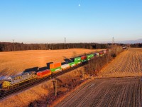 CN 185 (Detour) heads West up the Dundas Subdivision as the last golden rays of a very cold day illuminate the scene at Copetown West.  Leading the train is CN 3974 which is the ex CREX 1519.