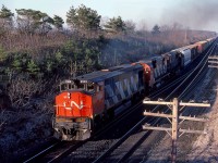 CN 2103 is in charge of train 392 at mile 5.8 on the CN's Strathroy Sub. Trailing are a couple of Big's , CN 2020 and 2010.