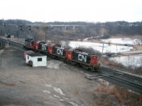 I thought this an odd sight.  CN 4523 with CN MLW S-4 switchers (S-7?) 8171, 8164 and 8167 heading eastward thru Bayview one morning.   The series 8163-8195 were being retired 'en masse' around this time, and it got me wondering if these three units were on their "last run"...and heading to Mac Yard.  I recall many of them working Hamilton yard at one time but slowly being replaced.