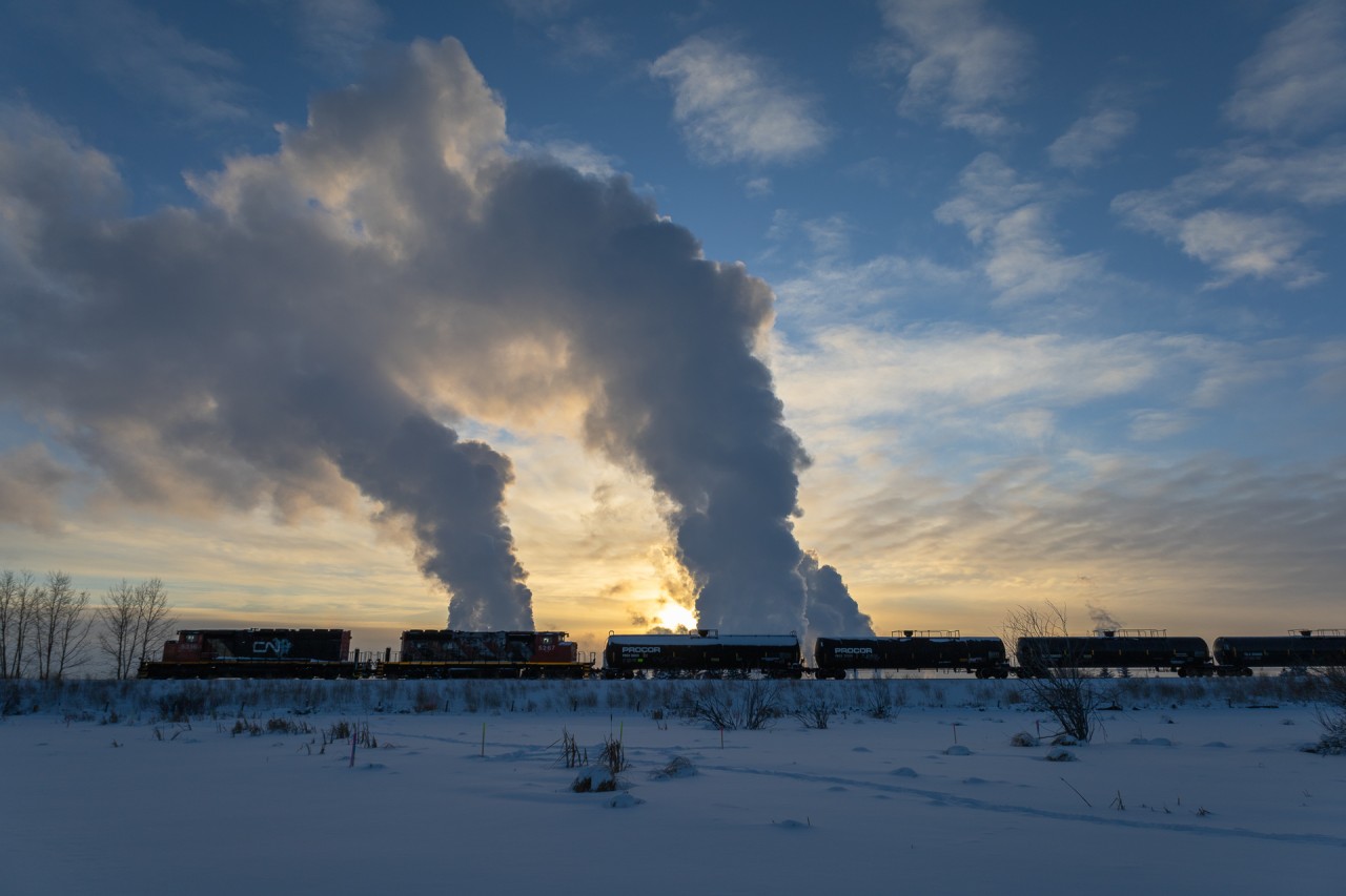 On a bone chilling afternoon, L 51251 07 with CN 5316 and CN 5267 hold at Harris to meet Q 19991 02 which was detoured across the Prairie North Line due to cold weather congestion on the mainline.