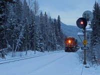 Due to the washouts on the Ashcroft and Yale Subs, Q 11751 16 has been staged just west of Jasper for a few days.  As a snowy day in the Rocky Mountains draws to a close, a new crew has just boarded and prepares to head westwards up Yellowhead Pass.