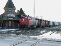 For a few months back in 1988, the CN leased five Bessemer & Lake Erie SD9s. They were numbered 825, 827, 829, 841 and 843. Only a couple of times was I able to catch any of them, and of course they were trailing units. Heading to Fort Erie on train #431 are B&LE 841 and 825 behind CN 9636 about to cross over Ontario St in Grimsby.  The classic station pictured burned down in an electrical fire on New Year's Eve, the last day of 1994. When CN no longer had use for the building; it became part of "Grimsby Depot", a commercial venture that supported the station as a restaurant and some boxcars as 'shops'.  It failed. Good idea, but off the tourist route. The restaurant held on though, under several names, right to the end. At the time of this photo, it was "Railhouse" restaurant. A waiting room for passengers riding "The Budds" was maintained.
I was lucky for some high clouds. A shot at this angle mid-day is almost directly into the sun.