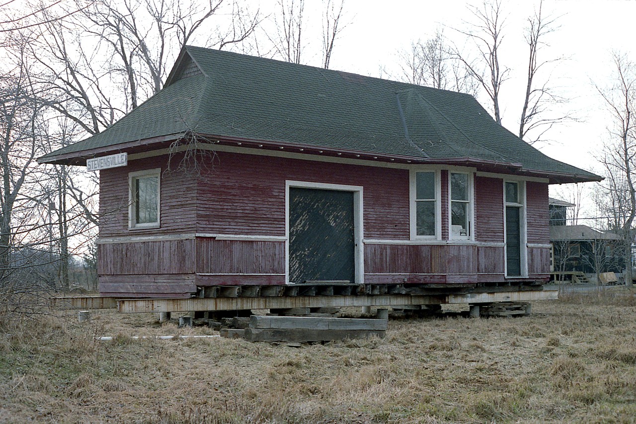 I haven't any information on this place, other than it dates to 1900.  This is a photo of the old CN Stevensville railroad station, moved to behind (and mostly out of sight) private residence in town. By the appearance of this, the station must have been moved in 1987, although I do not recall ever seeing it trackside, and I don't know how it would have gotten by me. So I have no idea how long it actually has been sitting there on its supports when I grabbed this shot. The building has settled in nicely over the years at this location, but is hard to photograph now due to foliage and other such 'photo deterrents' in the way.