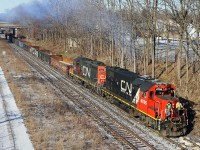 "Steeltown". "The Hammer". For railroaders, these names bring to mind heavy, slow drags with cars of steel (gondolas, coil cars, flats) and other industrial cargo. Here we see 0800 Hamilton Yard assignment heading towards "the hole" (N&NW spur) with a sizable number of gons. Yesterday when I saw this job, they returned to Stuart Street with something like 40 cars and 5600 tons--no wonder they use two or three unit sets of old road power such as GP38-2 4705 (ex 5505)and 7241 (rebuilt for yard service from GP9 4311)! To see the same location in 1975, http://www.railpictures.ca/?attachment_id=47735 .