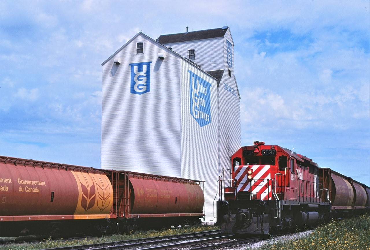 A single SD40 number 5537 leads a westbound train peddling empty grain cars at numerous grain elevators along CP's main line in southern Saskatchewan.
