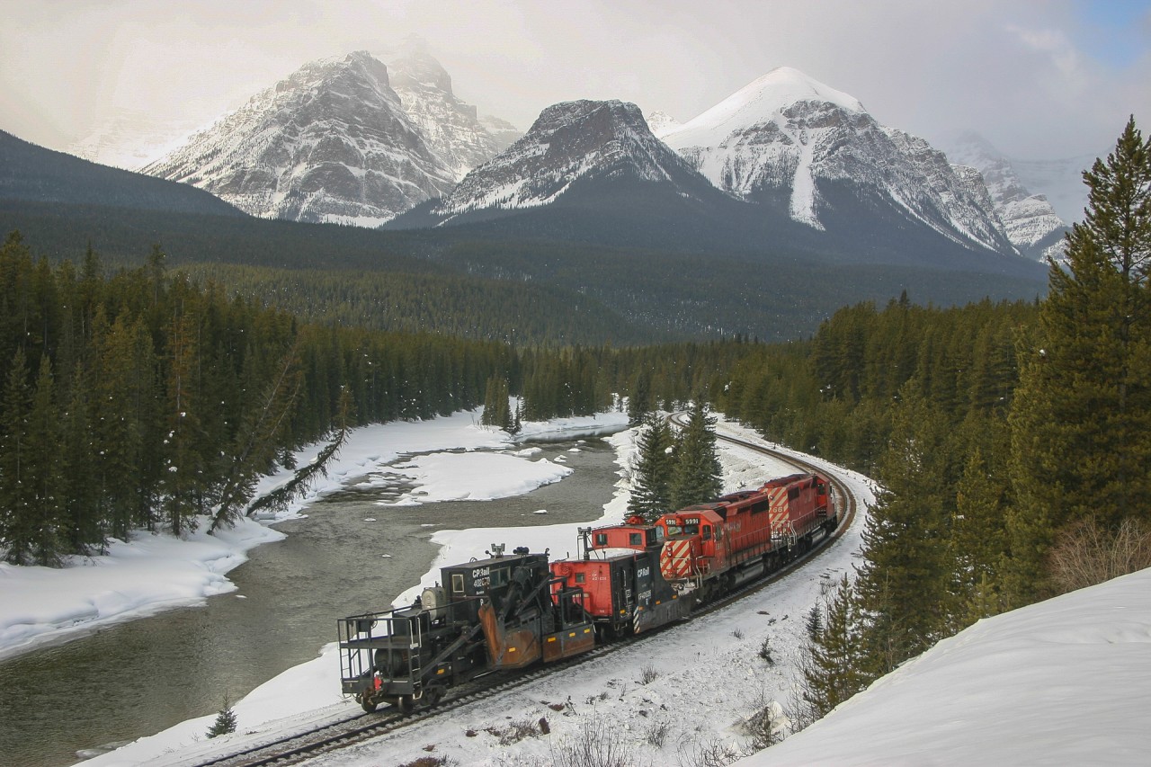 CP 5766 and CP 5991 roll through Morant's Curve with plow CP 401036 and spreader CP 402870, bound for the Field Hill, where the military is preparing to set off a few avalanches.