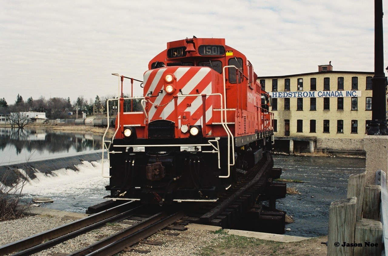 The CP Galt Job is viewed slowly crossing the Speed River in Preston, Ontario on the Waterloo Subdivision with 1501 and 8161 hauling 12 cars for Kitchener. They would later meet the CN 15:30 Yard Job at South Junction in Kitchener.