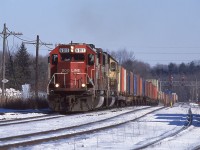 Here is one of those daily sights (at the time) that has aged quite well in my opinion.  CP 159 is seen topping the escarpment at Guelph Junction with the standard pair of SOO SD60s.  SOO Line SD60s were a daily, often multiple times a day sight on the Galt Sub for years if not decades.  Personally I never got bored of them, but at the same time never got overly excited either.  Today I'd be chasing this thing till I ran out of light, but at the time it was just another one and done train, maybe the next one will have something even better.




