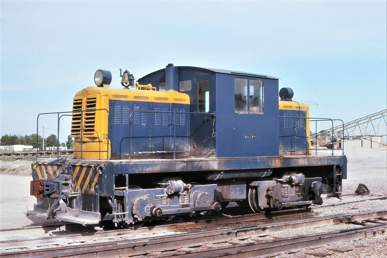 While roaming around on June 5th, 1977, I found this little beast at the Consolidated Sand & Gravel facility on CN's Uxbridge Sub near Millikens, Ontario.  I could not find any evidence of a unit number or builder's plate, but research indicates it was built in 1950 by Canadian Locomotive Company in conjunction with Whitcomb.