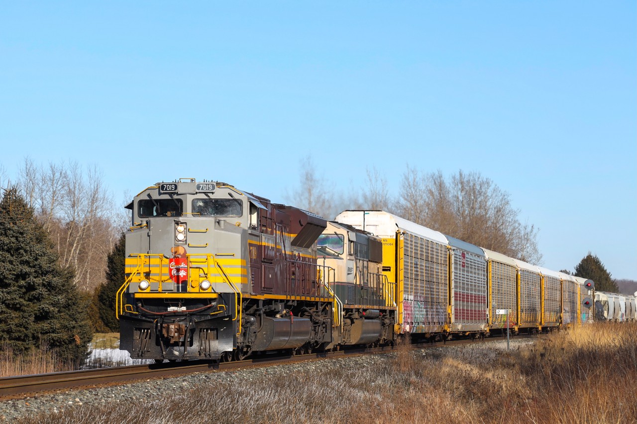 2022.01.15 CP 7019 leading CP 235-15, BNSF 9572 trailing, crossing the Melrose Diamond on Windsor Sub.