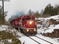 CP T06 heads southbound on the Nepthon sub from the mines through some rock cuts around mile 10. This train was a must see with the endless ecos leading this job, today it had 3004 leading one way and 3063 leading the other way!