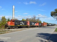 CN GP9RM #7029, GP38-2 #7515, and another GP9RM #7052 lead the 0700 Yard Job out of Parkland Fuels along Hobson Road and back towards the N&NW in Hamilton, ON.