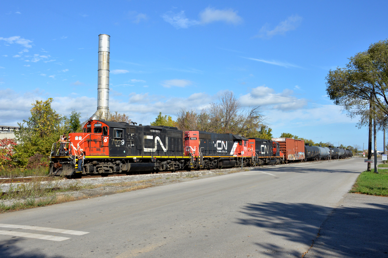 CN GP9RM #7029, GP38-2 #7515, and another GP9RM #7052 lead the 0700 Yard Job out of Parkland Fuels along Hobson Road and back towards the N&NW in Hamilton, ON.