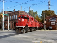 CP GP38-2 #3117 leads TH21 down the belt line, headed back towards CP Kinnear Yard after working in the lovely industrial area in Hamilton.