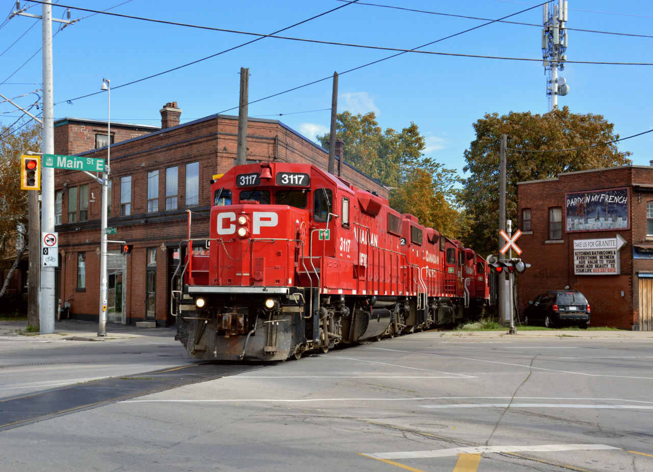 CP GP38-2 #3117 leads TH21 down the belt line, headed back towards CP Kinnear Yard after working in the lovely industrial area in Hamilton.