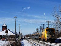 VIA 60 is departing Dorval Station with VIA 918 and four HEP cars. Most VIA Rail trains in either direction are on the South Track of CN's Montreal Sub here, but with VIA 65 boarding passengers on the South Track, VIA 60 was lined to the North Track.