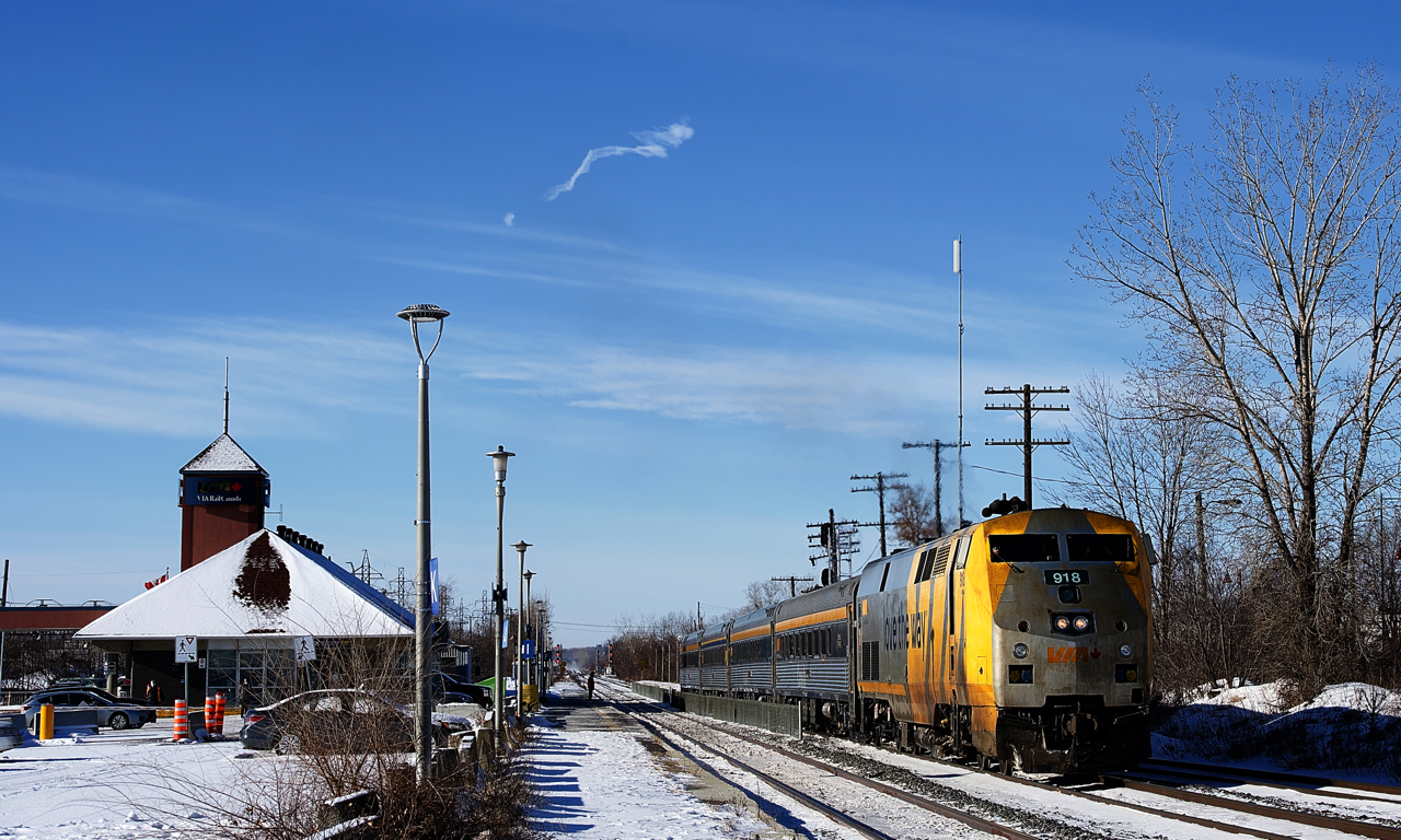 VIA 60 is departing Dorval Station with VIA 918 and four HEP cars. Most VIA Rail trains in either direction are on the South Track of CN's Montreal Sub here, but with VIA 65 boarding passengers on the South Track, VIA 60 was lined to the North Track.