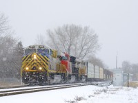 CN 305 has ex-CREX units first and third as it heads west with CN 3918, CN 3191 & CN 3940 for power as the snow falls.