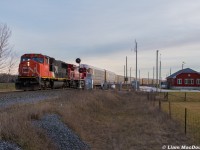 With the remaining sunlight of the day quickly fading/disappearing behind clouds, CP 2-T49 reverses into Spence Yard with a CN SD70i on point, looking a little lost this far up the Mactier Sub. 
