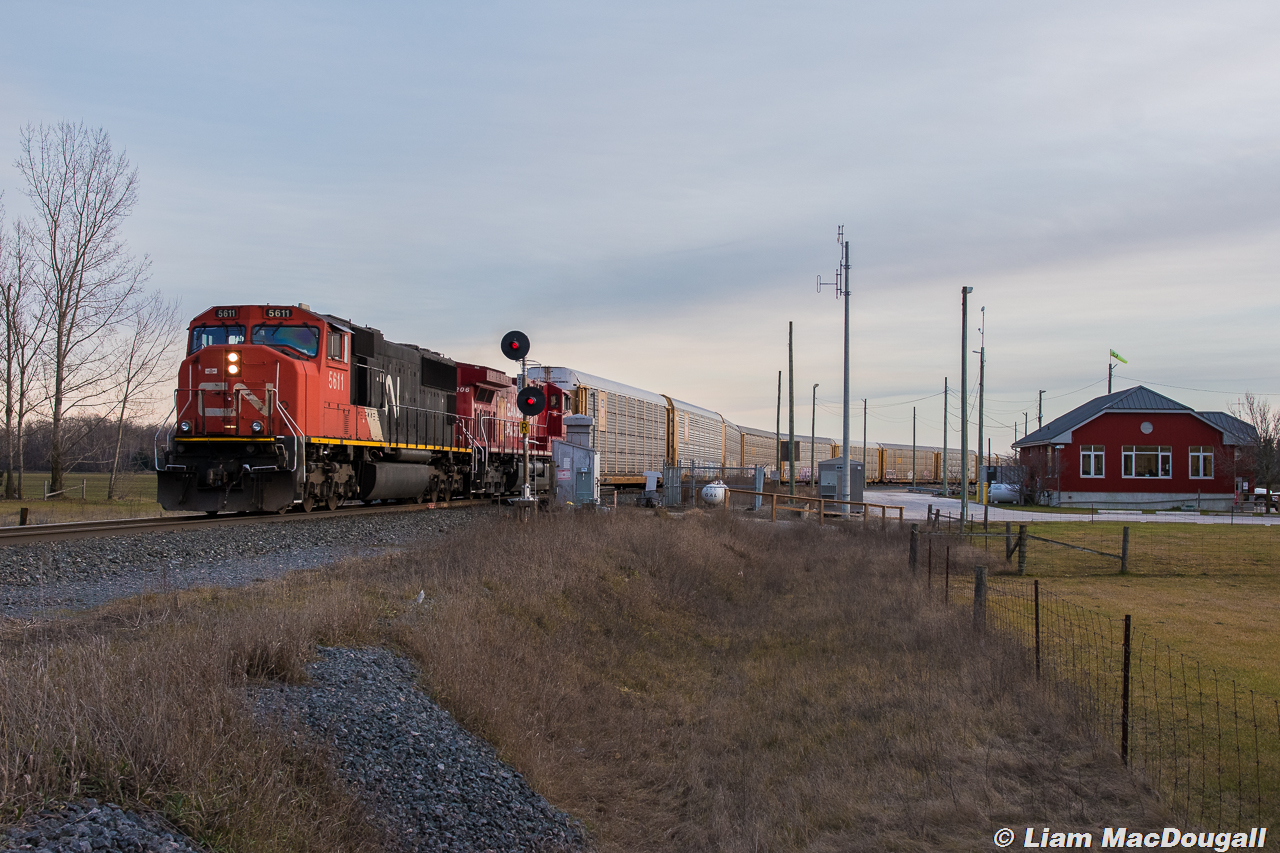With the remaining sunlight of the day quickly fading/disappearing behind clouds, CP 2-T49 reverses into Spence Yard with a CN SD70i on point, looking a little lost this far up the Mactier Sub.