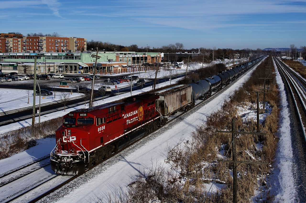 CP 8036 is in decent paint as it brings up the rear of loaded ethanol train CP 650 on cold winter afternoon. It was rebuilt from CP 9509 in 2018.