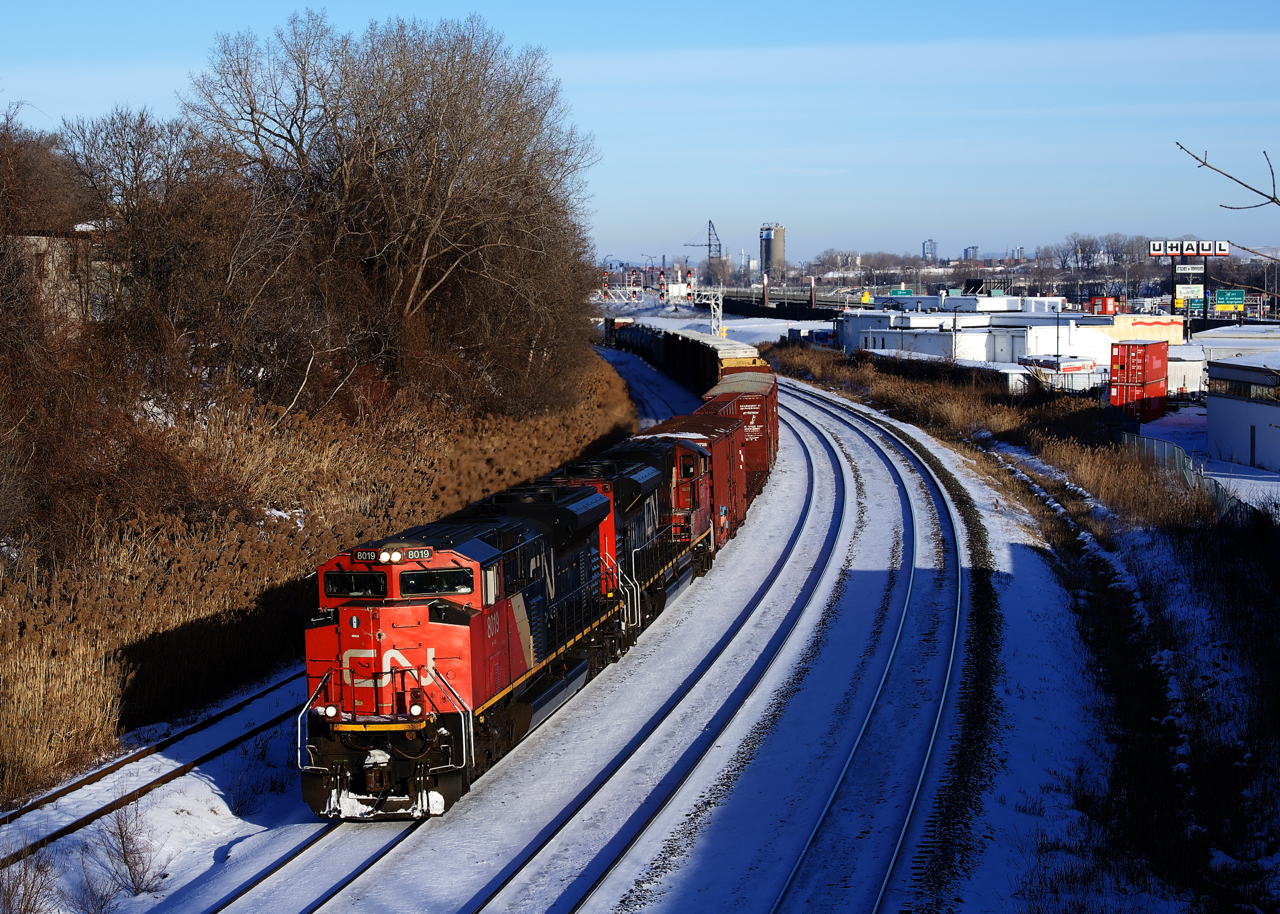 CN 527 has 103 cars and a pair of SD70M-2's for power (CN 8019 & 8963) as it heads towards Taschereau Yard.