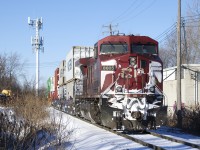 Snow-covered CP 8605 brings up the rear of CP 112 as it approaches its terminus of Lachine IMS yard.