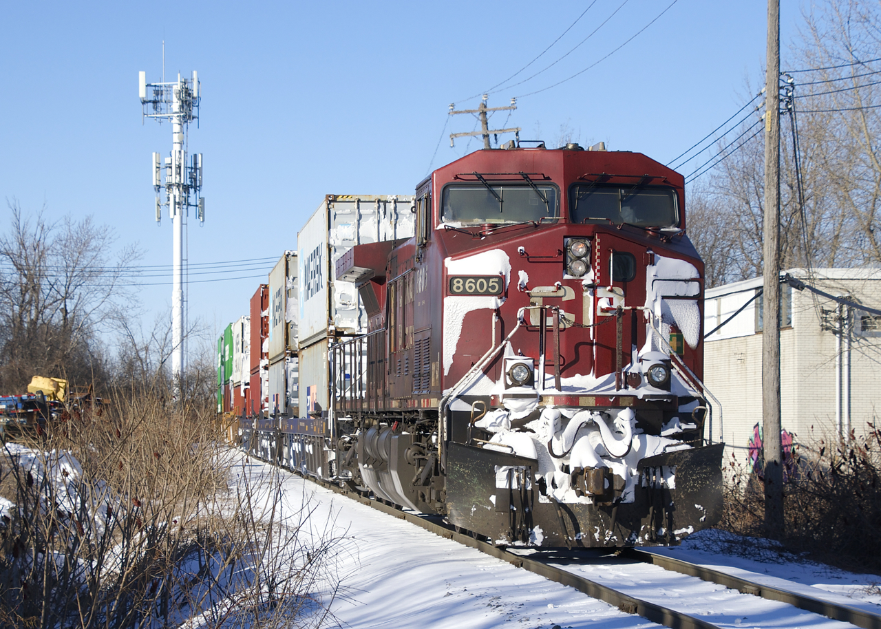 Snow-covered CP 8605 brings up the rear of CP 112 as it approaches its terminus of Lachine IMS yard.