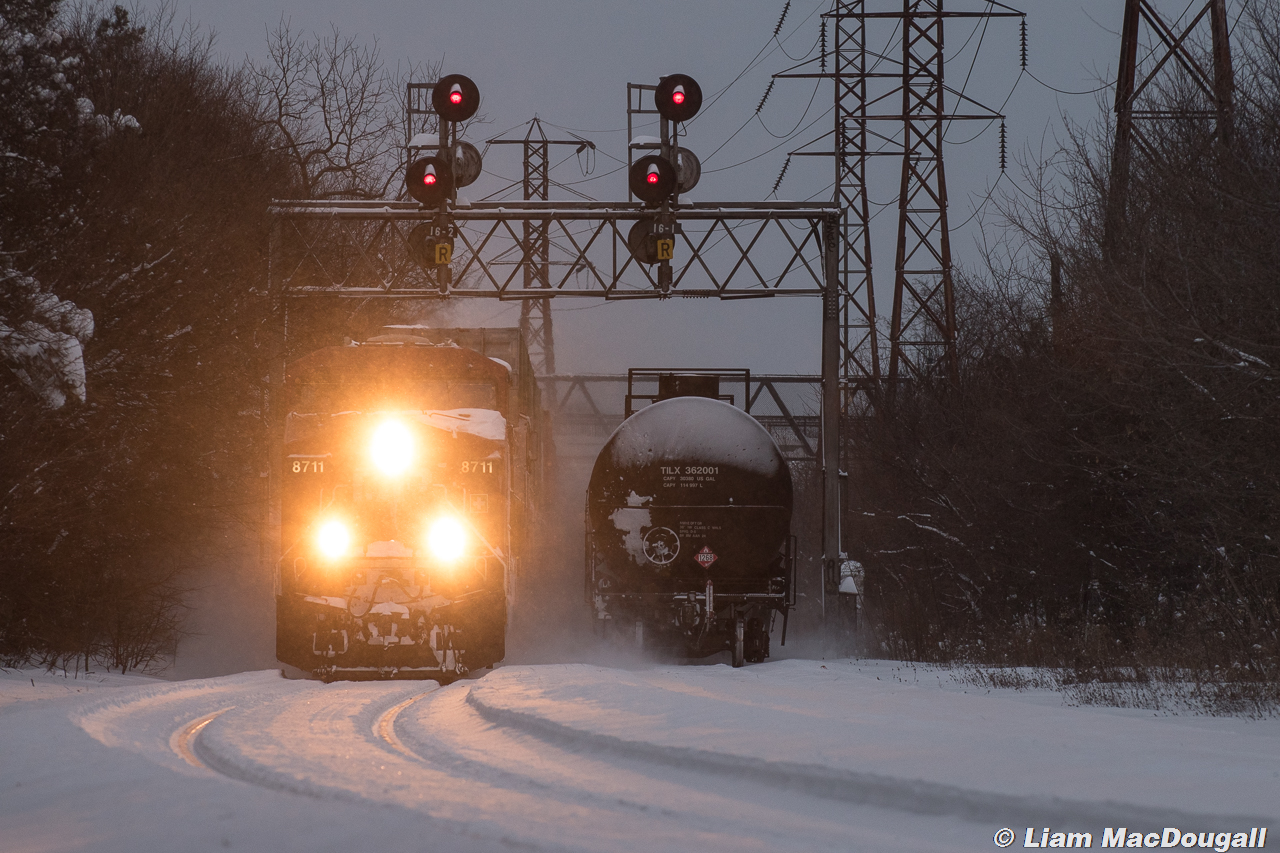 Winter Wonderland

CP 119 is about 11 hours late as it moves through mile 1.6 of the North Toronto Sub at dusk through around 40cm of freshly fallen snow. Sitting on the south track is an outlawed 118 which tied down earlier in the day due to the crew running out of hours on their shift.