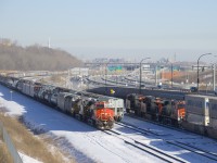 CN 120 is passing a CN 305 which is temporarily tied down on Track 29 of CN's Montreal Sub.