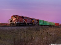 With the CP 6013 proudly up front as a nod to days gone by, CP 8-420 enters Vaughan Yard under a blanket of purple skies as they prepare to drop a sizeable cut of intermodal in the aforementioned yard. 