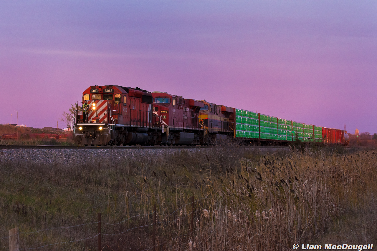 With the CP 6013 proudly up front as a nod to days gone by, CP 8-420 enters Vaughan Yard under a blanket of purple skies as they prepare to drop a sizeable cut of intermodal in the aforementioned yard.