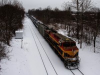 A bit of snow is falling as KCSM 4755 brings up the rear of loaded ethanol train CP 650, which has just changed crews and is now heading south towards the U.S.