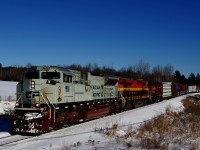CP 251 has a wild lashup as it rounds a curve with navy unit CP 7022, KCS 4820 and CP 8107 for power.