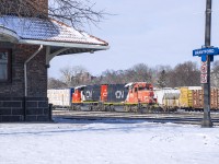After setting off a cut of cars from Mabe, the crew of 580 takes lunch in the yard office while waiting for 382, 148, and 397 to pass.  Afterwards they will depart with 3 loaded centre beams for Rembos on the Hagersville Sub.