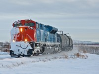 A snow caked CN 8952 leads an X405 north out of Regina on the Quappelle Subdivision at Victoria Plains.   